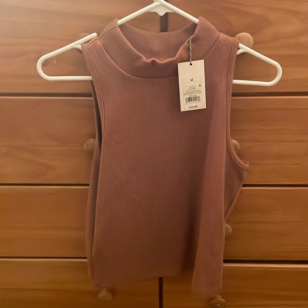 Brand new turtle neck tank. Size medium. “A new day”